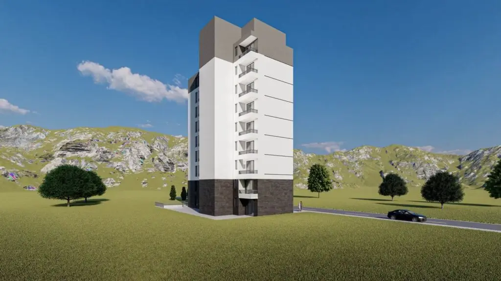 Tall modern apartment building in grassy mountain landscape