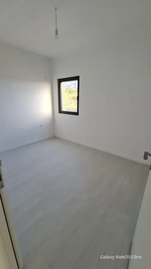 Empty white room with small window and hanging bulb, Galaxy Note20 Ultra