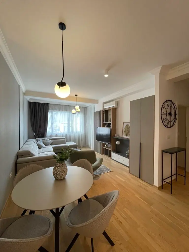 Modern living room with round dining table and sectional sofa