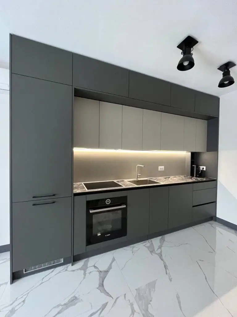 Modern gray kitchen with built-in sink and oven