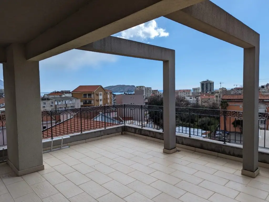 Spacious tiled terrace with city and sea view