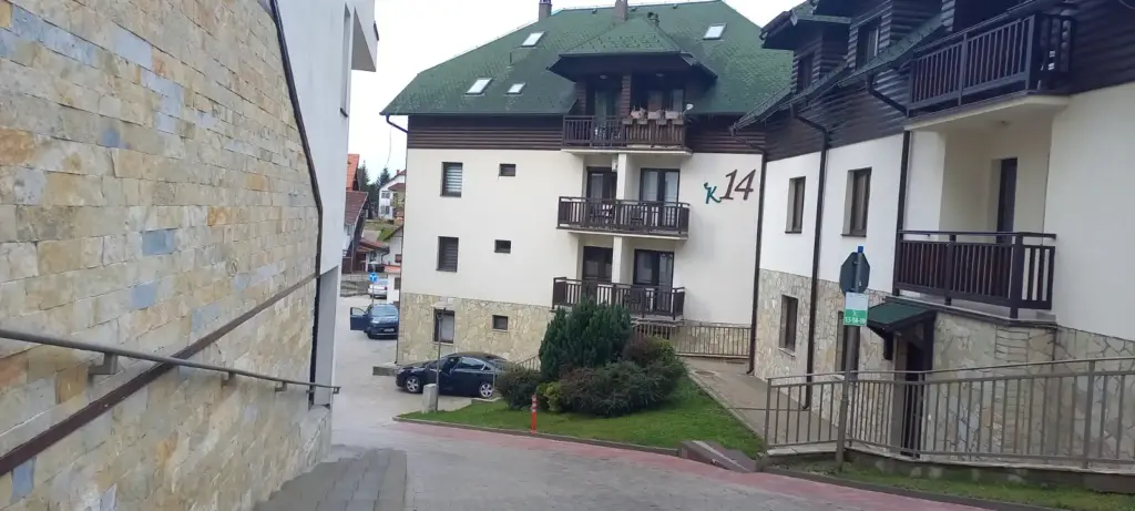 Apartment buildings with balconies along a narrow street