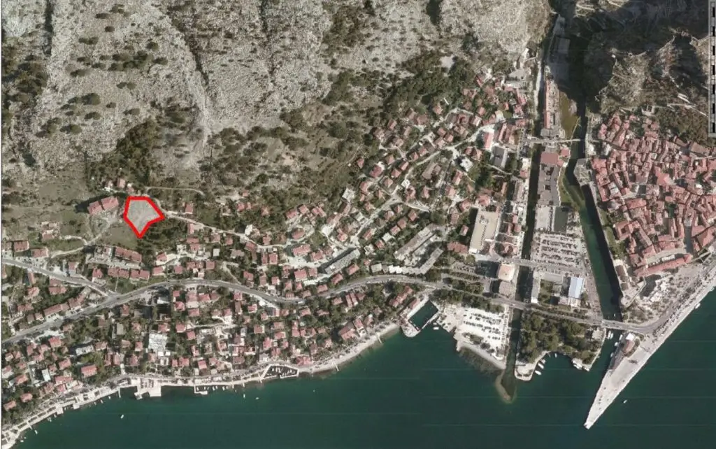 Satellite map with red outlined plot near the coast
