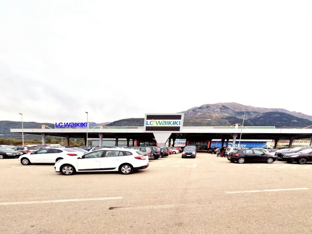 LC Waikiki store in a parking lot with mountains behind