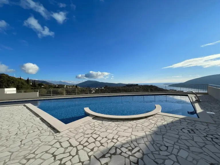 Outdoor swimming pool with sea and mountain view
