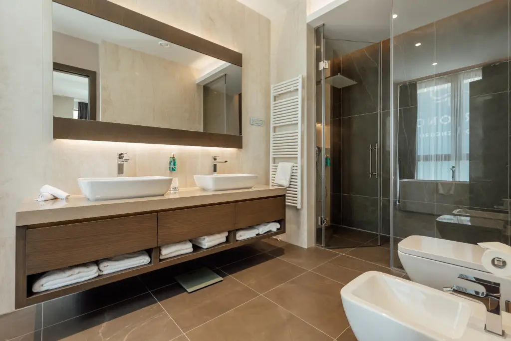 Modern bathroom with double sink vanity and glass shower