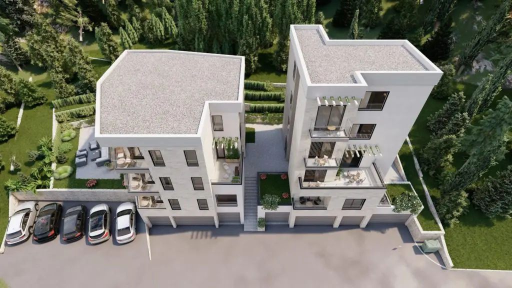 Aerial rendering of two modern white apartment buildings with balconies