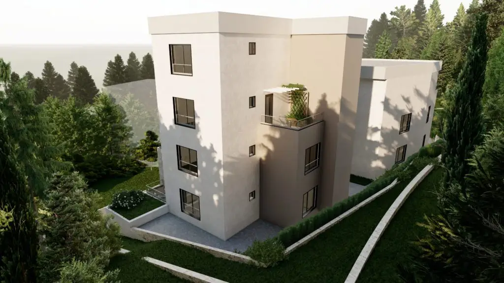 Modern beige apartment building surrounded by trees and greenery