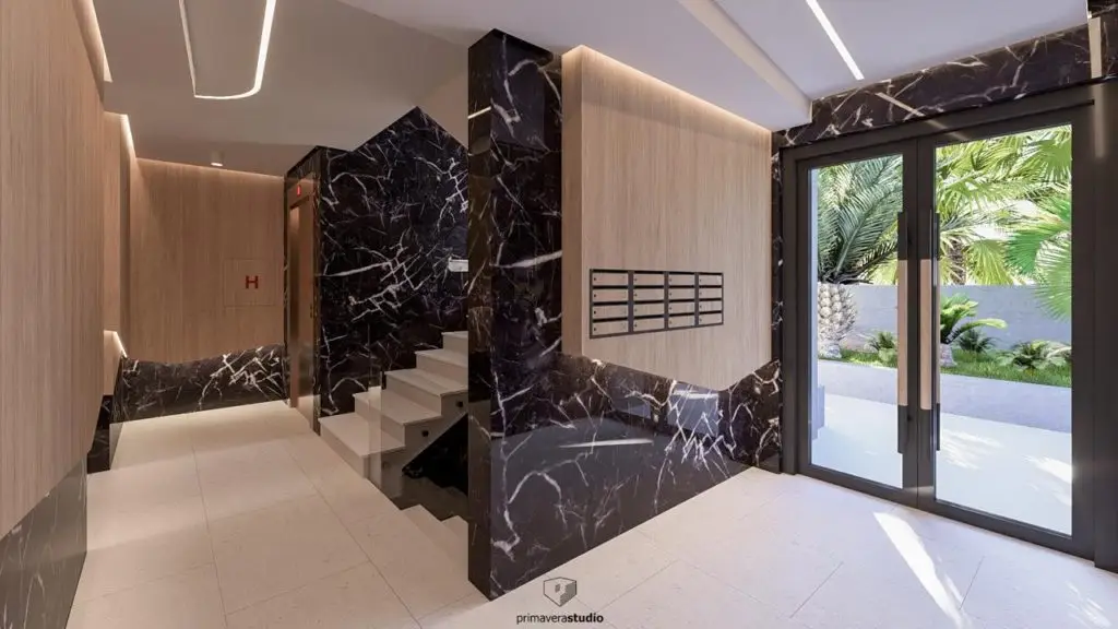 Modern lobby with marble walls, stairs, mailboxes, and glass doors