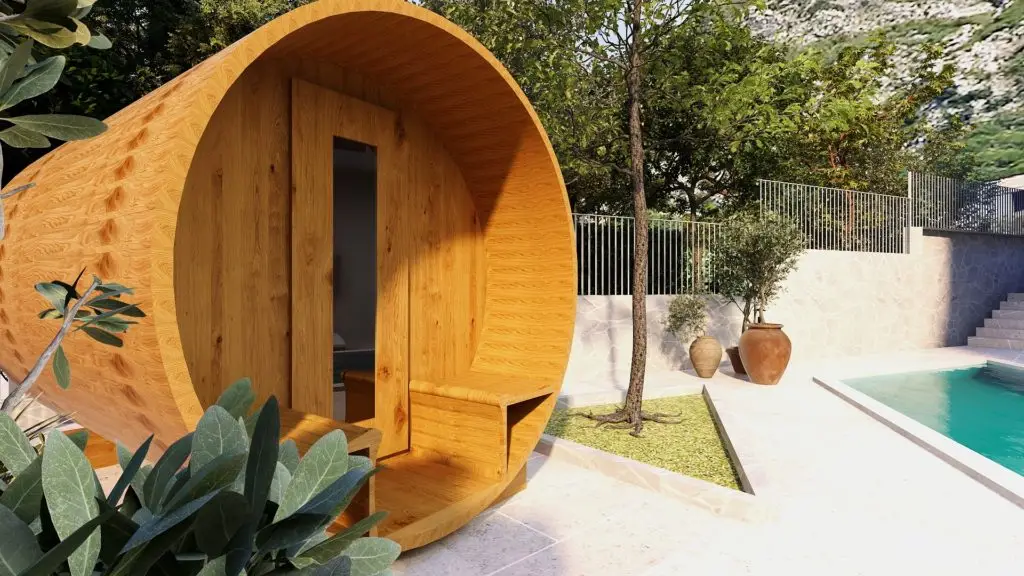 Wooden barrel sauna beside an outdoor swimming pool