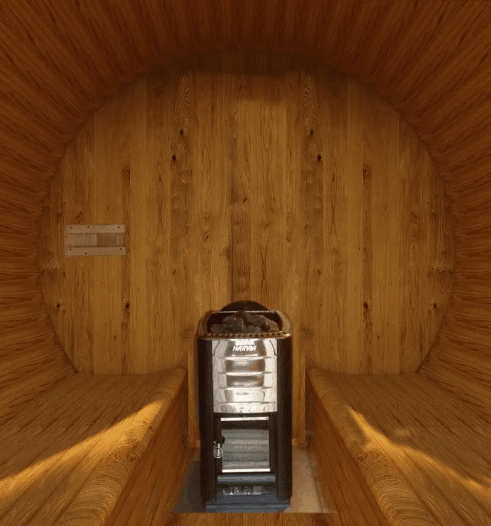 Wood-paneled sauna interior with Harvia heater and benches