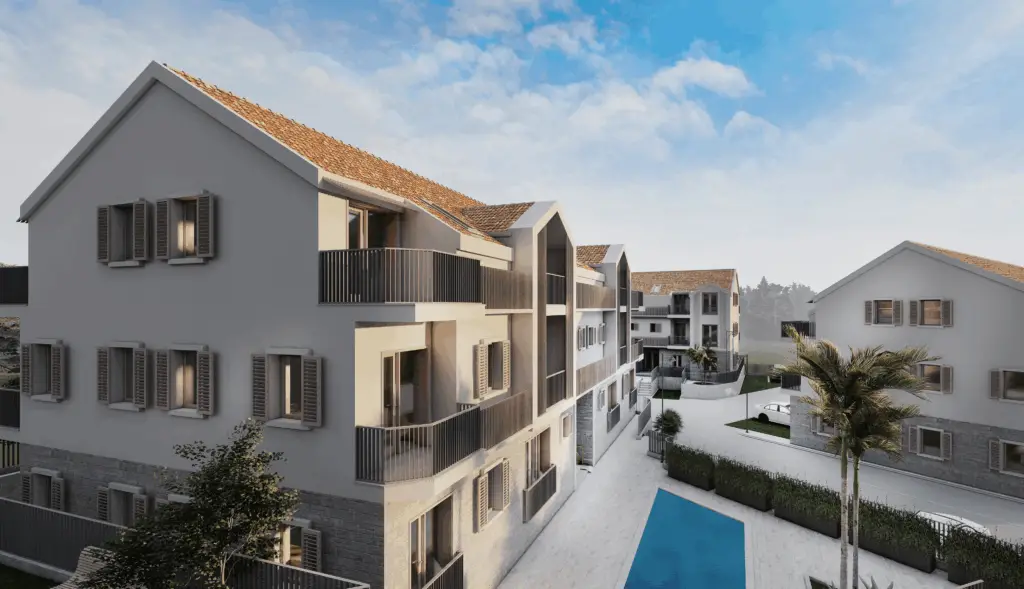 Residential apartment complex with balconies, pool, and palm trees