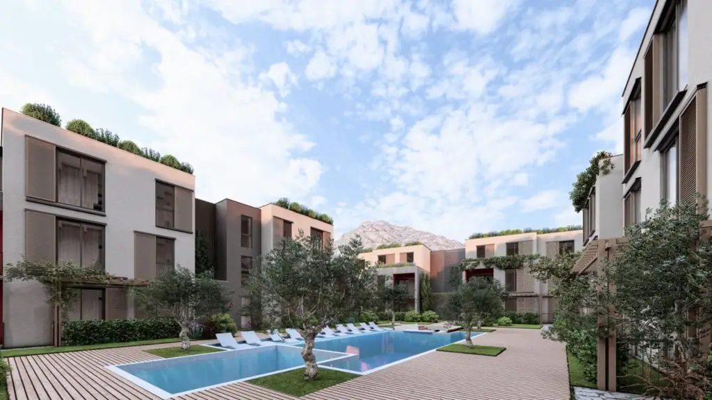 Modern apartment courtyard with outdoor swimming pool and trees