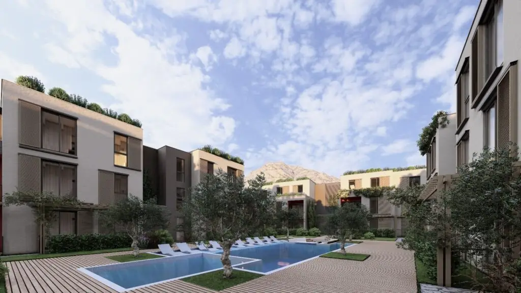 Modern apartment courtyard with pool and lounge chairs