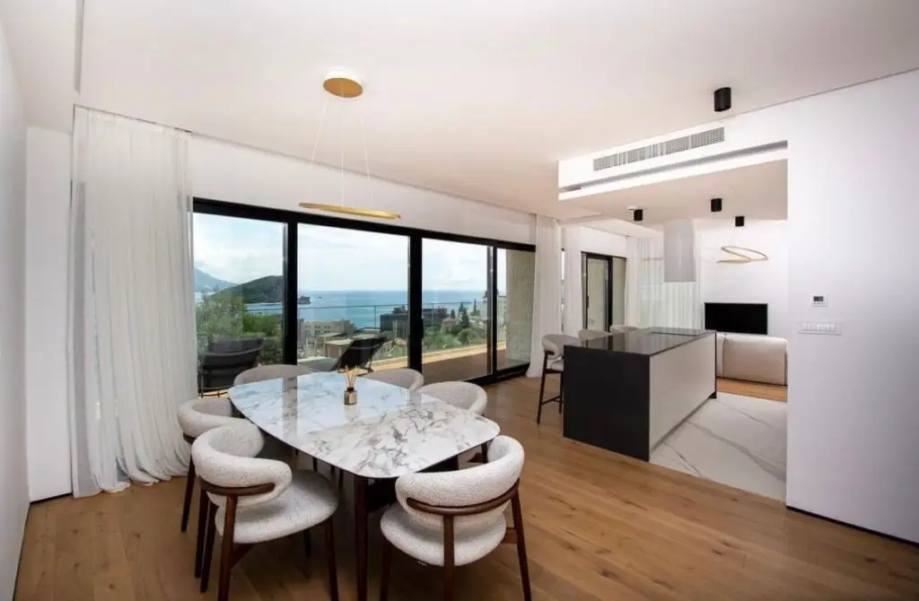 Modern dining area with marble table and sea view
