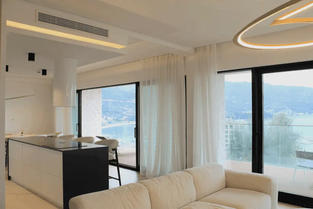 Modern living room and kitchen with balcony sea view