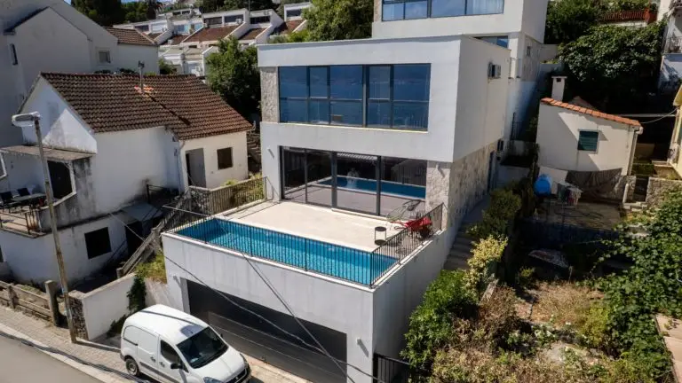 Modern white house with rooftop pool and garage