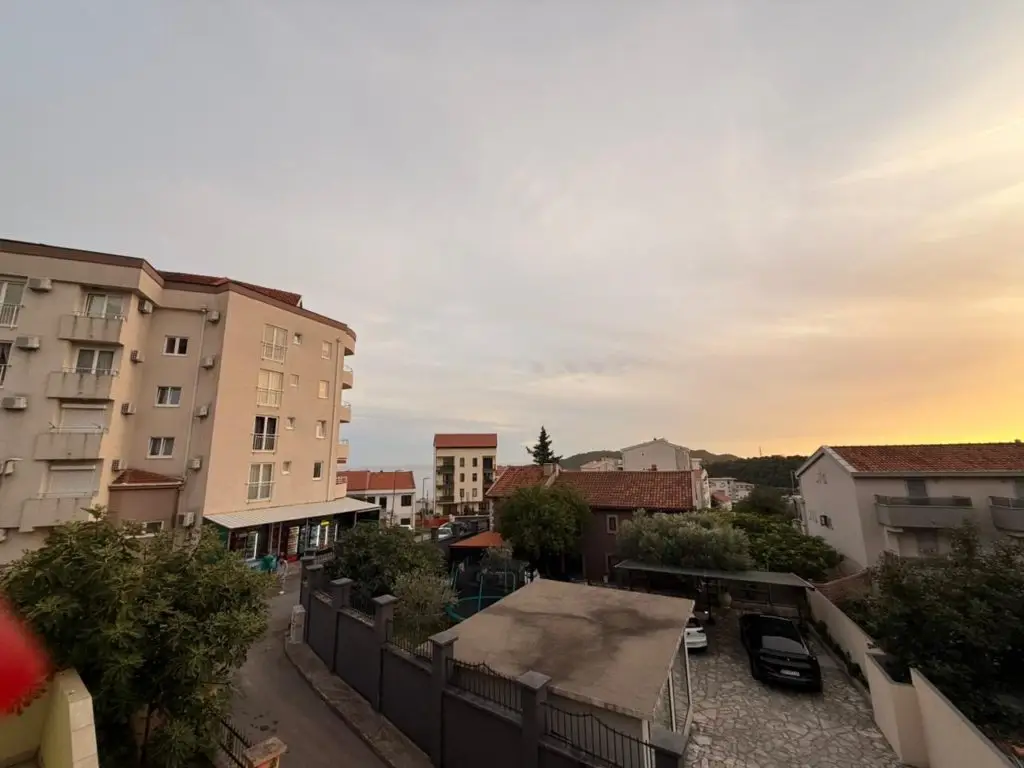 Apartment buildings and houses at sunset