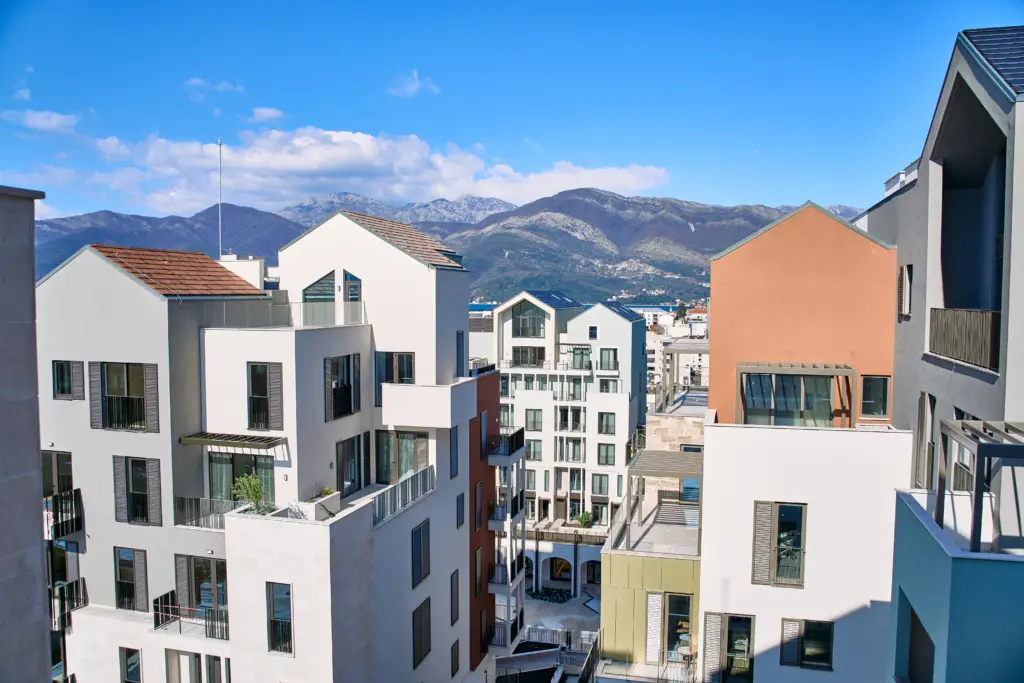 Modern apartment buildings with mountains in the background
