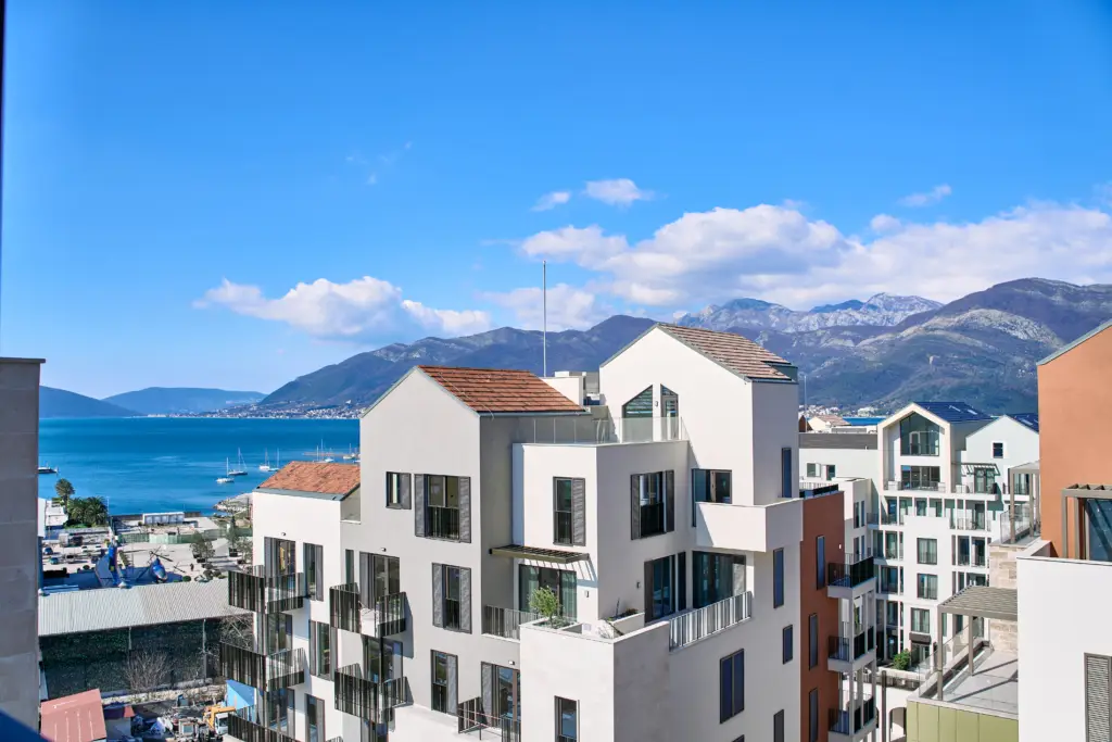 Modern apartment buildings overlooking the sea and mountains