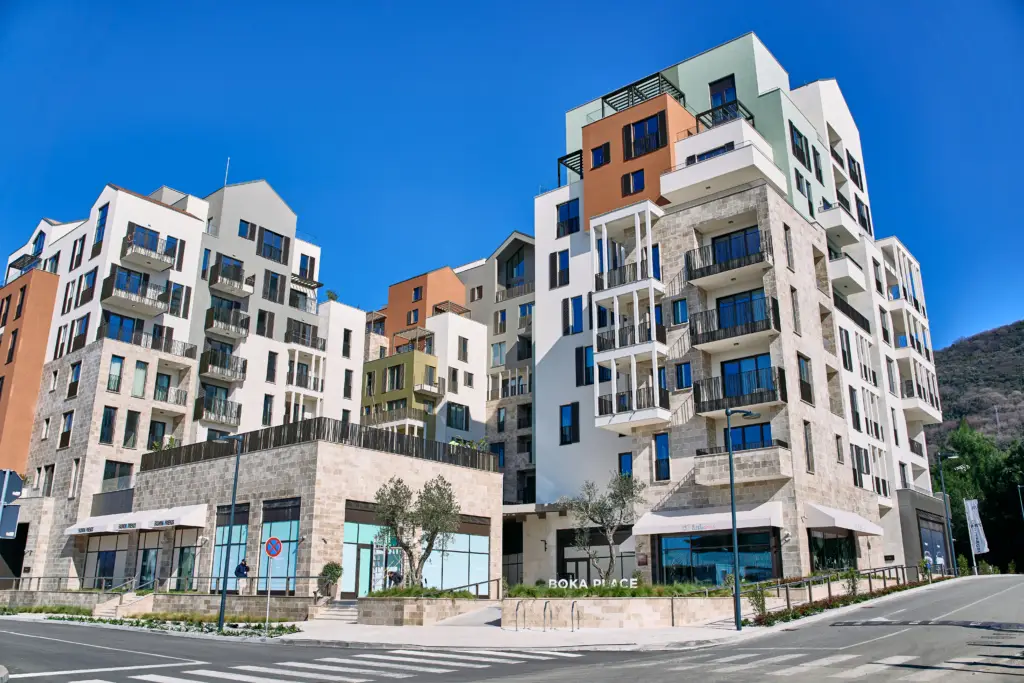 Modern apartment complex with BOKA PLACE sign