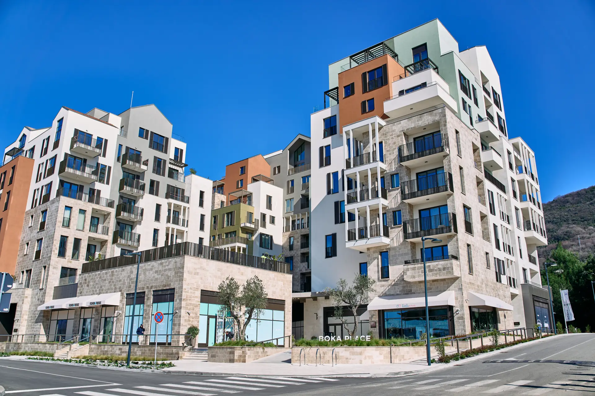 Modern apartment complex with BOKA PLACE sign