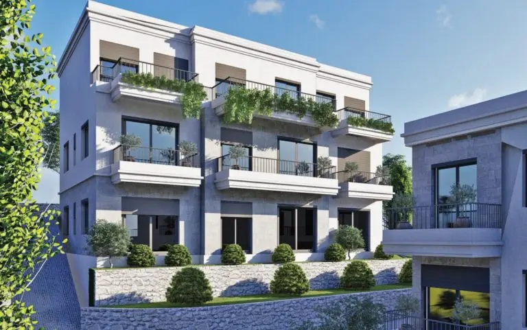 Modern apartment building with balconies and greenery