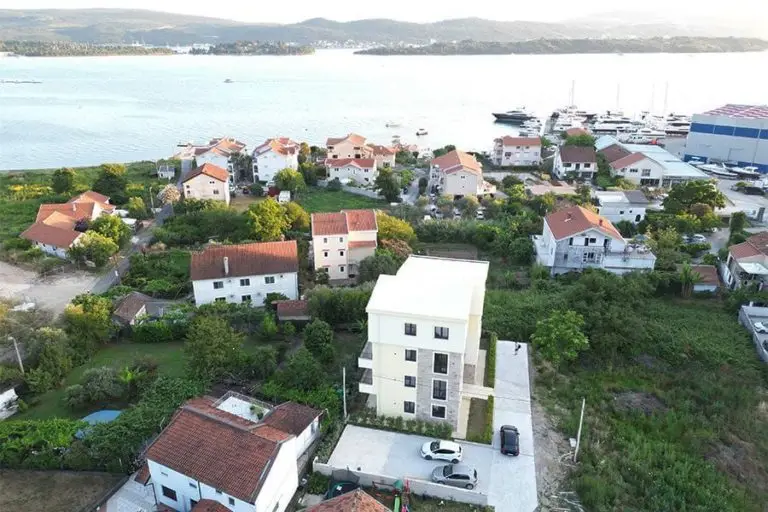 Aerial view of seaside homes, apartments, and marina