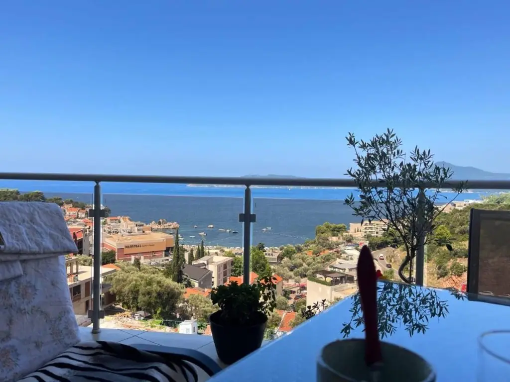 Balcony with sea view over coastal town