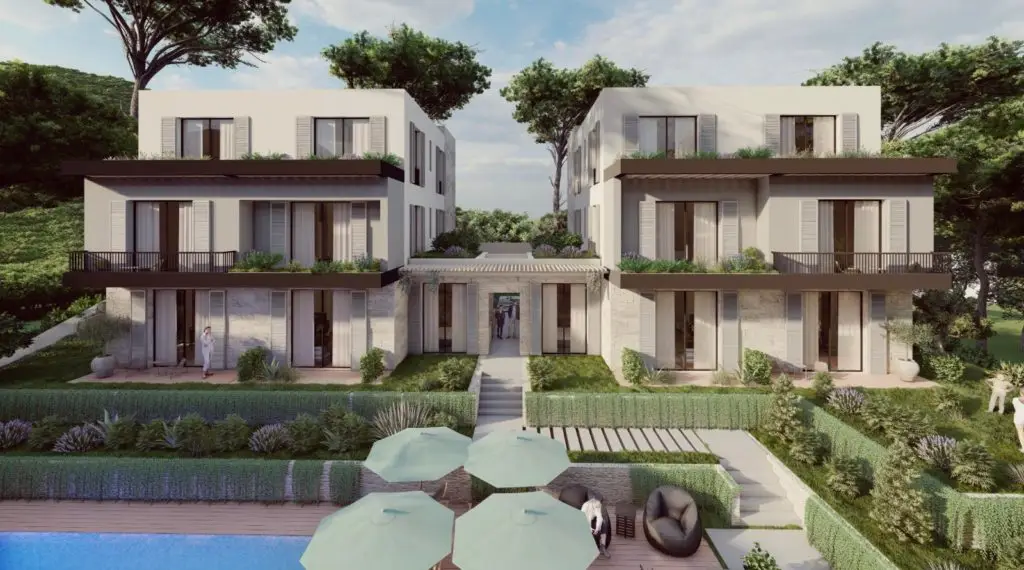 Modern apartment buildings with pool, umbrellas, and landscaped courtyard