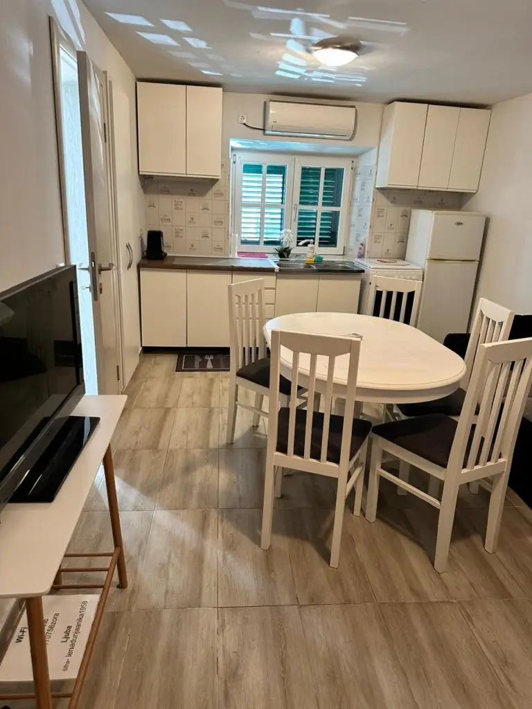 Compact kitchen with dining table and chairs