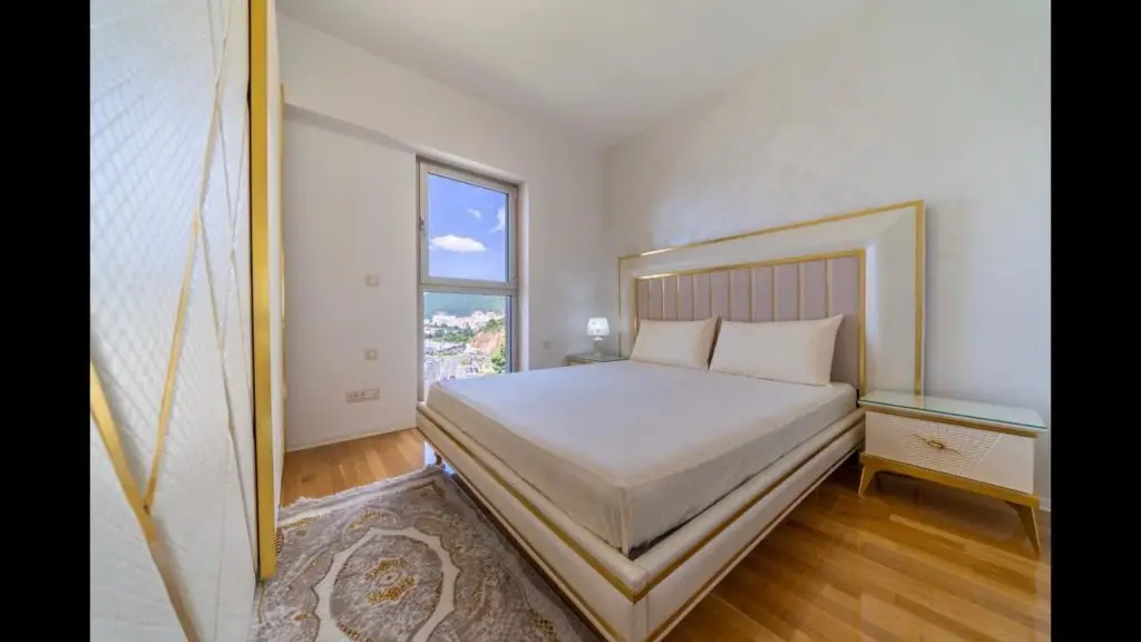 Modern bedroom with king bed and window sea view
