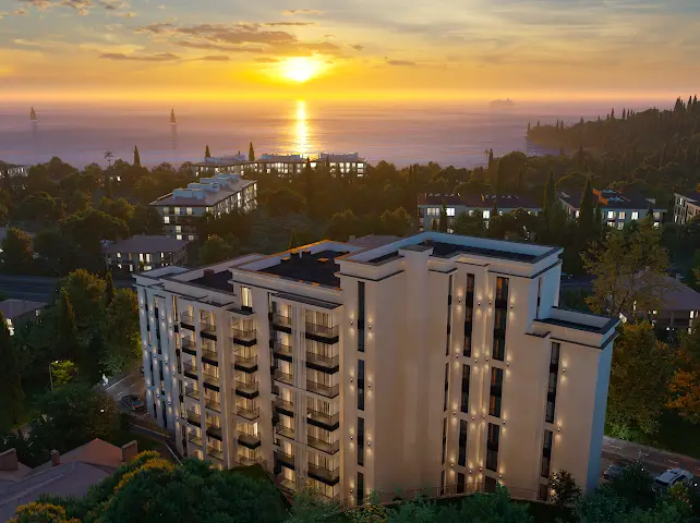 Modern apartment building overlooking the sea at sunset