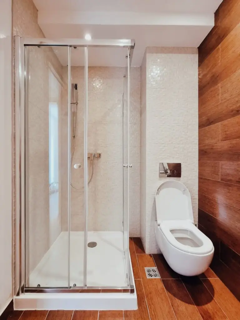 Bathroom with glass shower enclosure and white toilet