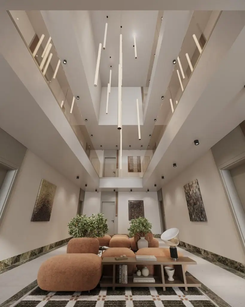 Modern lobby with beige seating and hanging lights