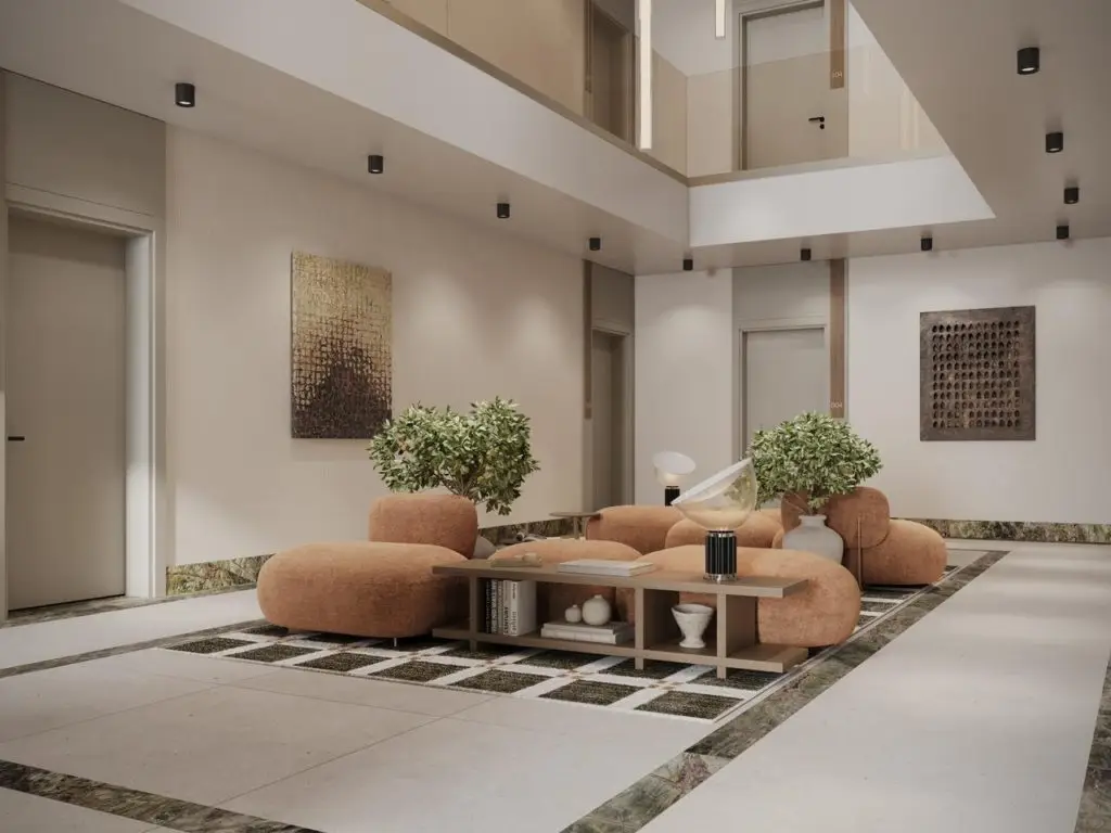 Modern apartment lobby with peach lounge chairs and plants