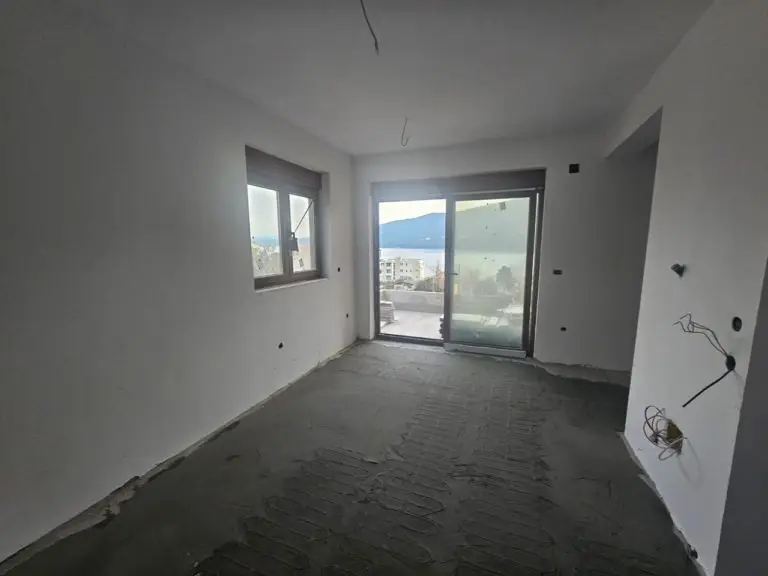Unfinished room with balcony doors and sea view
