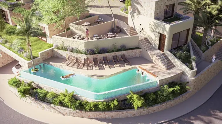 Luxury apartment complex with pool, loungers, and palm trees