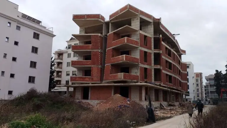 Unfinished red-brick apartment building under construction
